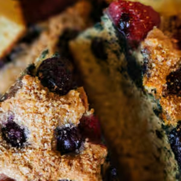 Close-up of a blueberry and raspberry scone with a sugary topping from Java Beach.