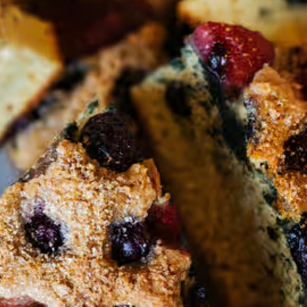 Close-up of Java Beach's berry scones, showing blueberries and raspberries baked into the golden pastry.